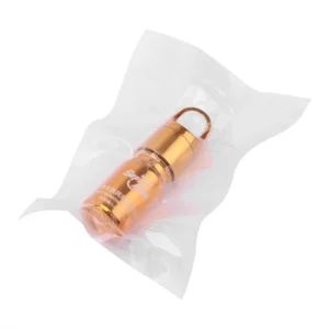 Gold-colored Super PDR glass repair liquid bottle inside a clear protective bag.